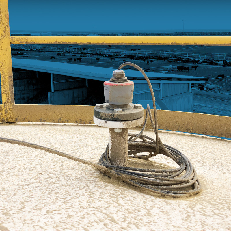 CNCR radar sensor mounted atop a bin in an agricultural application, measuring grain storage