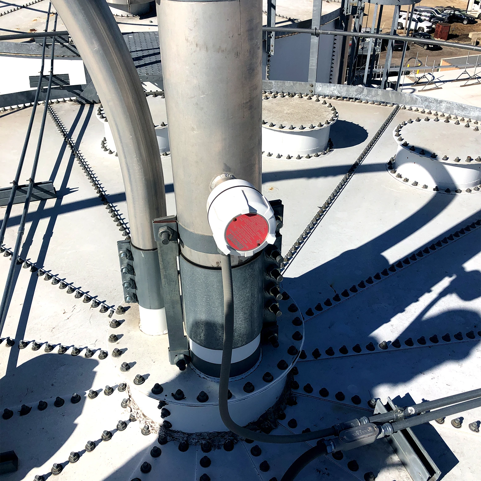 Flow Detect sensor installed atop a metal storage bin in the animal feed and grain processing industry