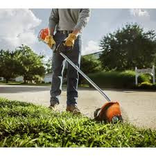 Stihl FC 70 edging tool creating clean lawn and garden borders