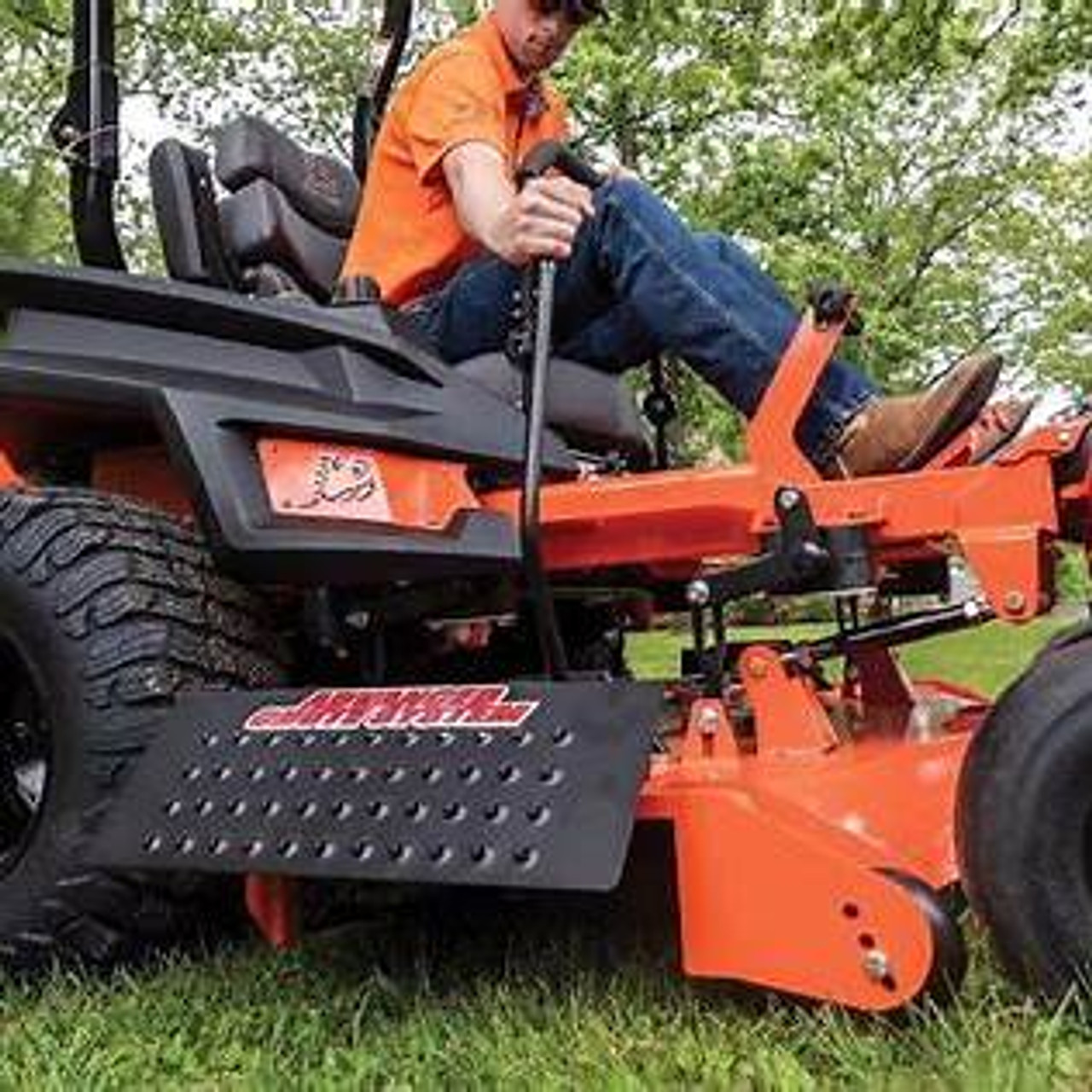 Operator engaging ACS 54″ Outlaw chute blocker over driveway