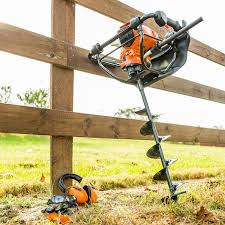 Stihl BT 45 wood boring drill with auger attachment in use