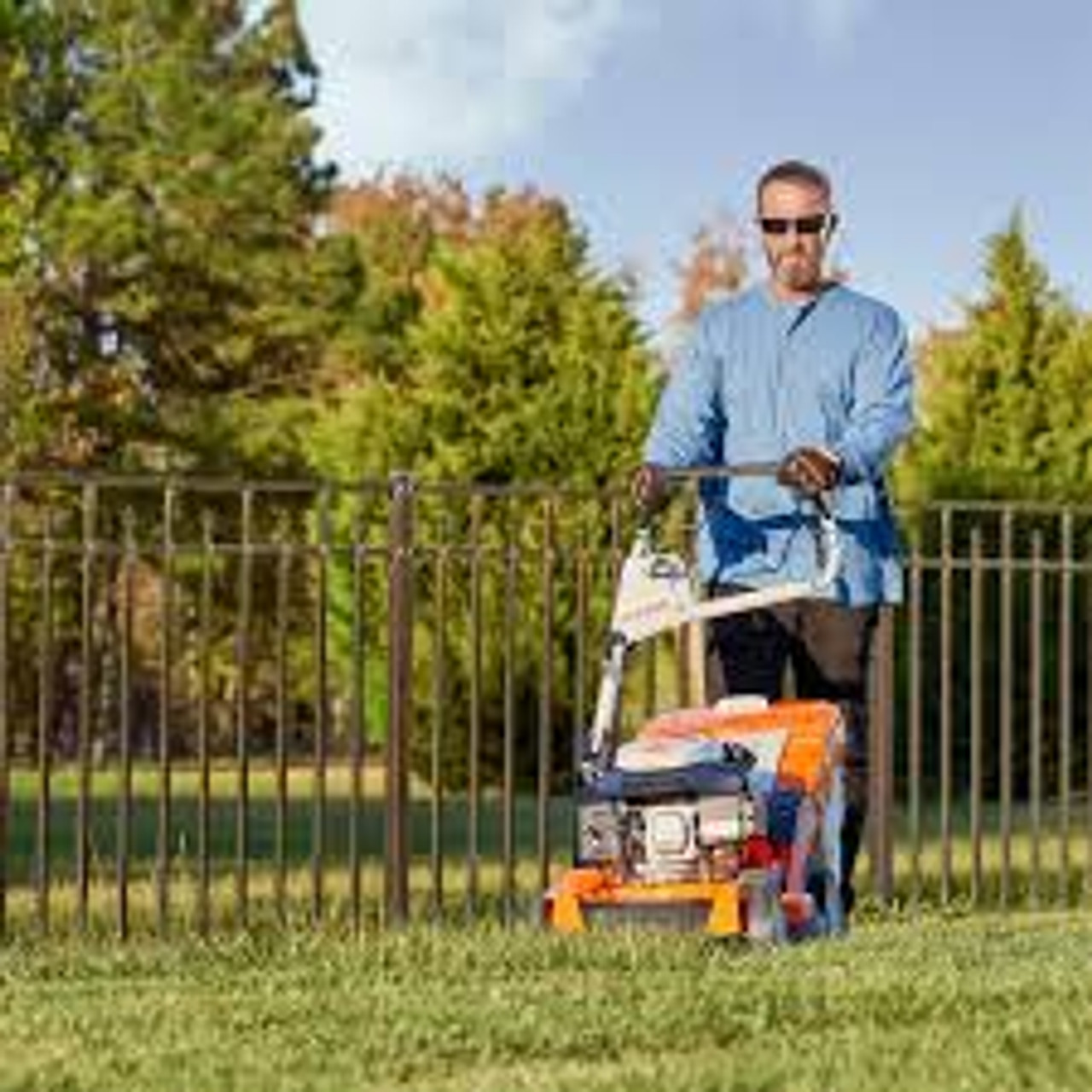 Stihl RM 655 V lawn mower with variable-speed drive cutting grass