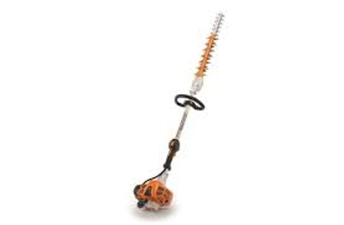 Professional landscaper using Stihl HL 91 K fixed-angle hedge trimmer