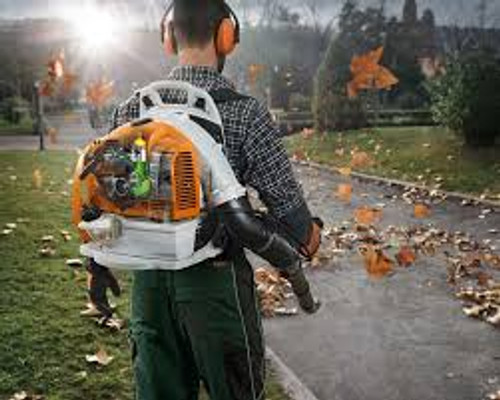 Landscaper using Stihl BR 350 blower for professional cleanup