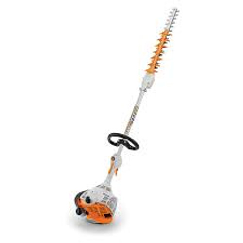 Stihl HL 56 K hedge trimmer cutting tall hedges in backyard