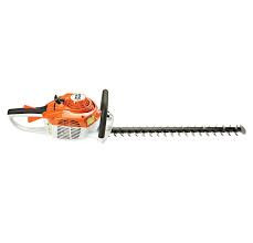 Stihl HS 46 C-E hedge trimmer cutting medium-sized residential hedge