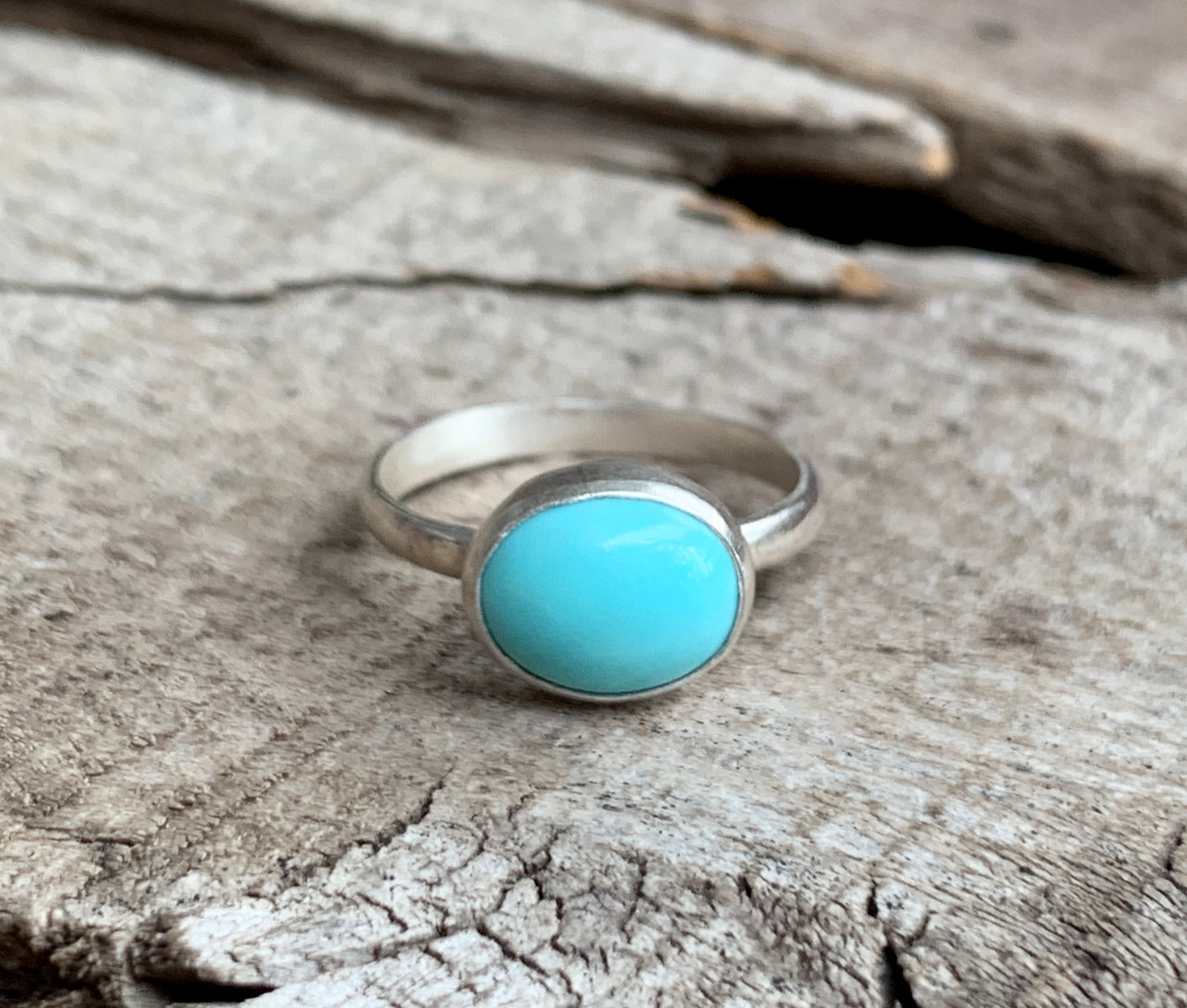 Light Blue Sapphire and Diamond Three Stone Ring