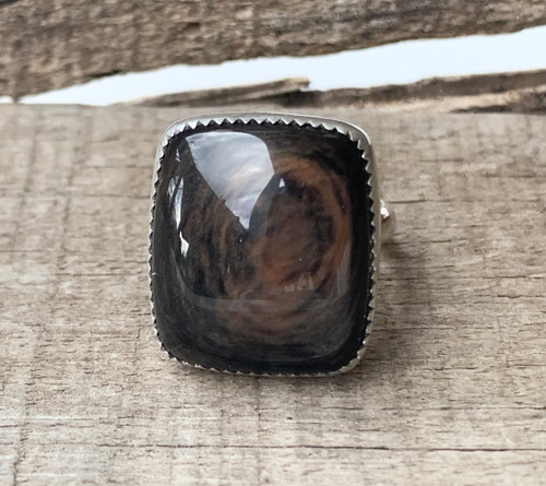 Luminescent Swirly Brown Cushion Cut Rectangle Tiger Eye in a Serrated Setting 