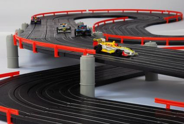 AFX Super International overpass with four Mega-G+ HO slot cars driving on the track