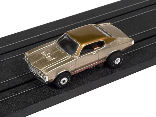 Auto World ThunderJet 1972 Buick GS tan HO slot car on track