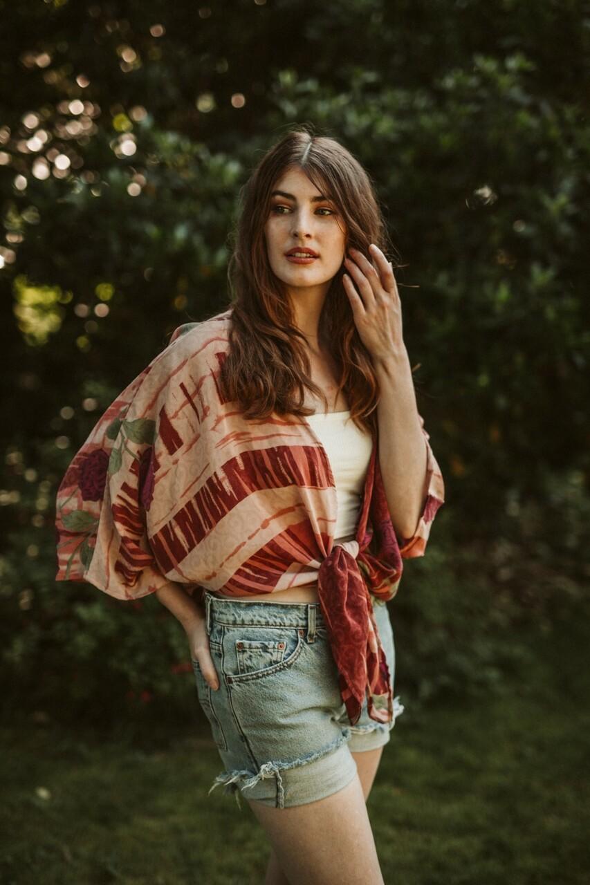 Body language and emotions. The girl the blonde in a plaid shirt poses in  studio on a white background.woman shrugs shoulders as doesnt know answer,  being clueless and uncertain. Stock Photo |