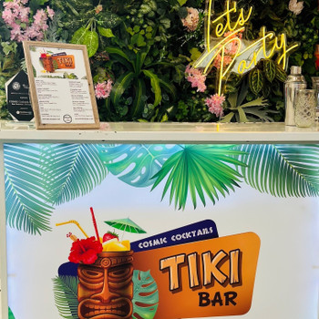 We have great decor to pair with our Tiki Bar, including our Neon Let's Party Sign and our Green Wall backdrop. We have great decor to pair with our Tiki Bar, including our Neon Let's Party Sign and our Green Wall backdrop.