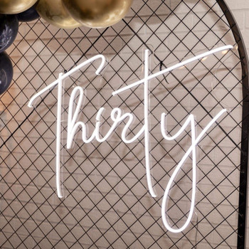 This Hanging NEON Thirty Sign Hire will light up any room and be the bright, stylish finishing touch to make your event sophisticated and leveled up! This Hanging NEON Thirty Sign Hire will light up any room and be the bright, stylish finishing touch to make your event sophisticated and leveled up!