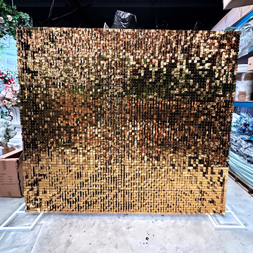 Our Gold Shimmer Wall Hire is the best way to make your  event look premium and expensive as well as bright and fun.