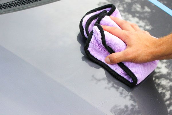 Flip to a clean side of your microfiber towel and buff away any excess product to reveal a glossy surface and excellent water beading!