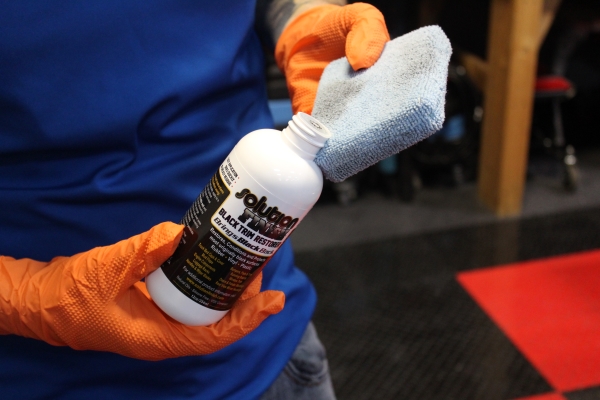 Apply the Trim Restorer to a microfiber applicator.