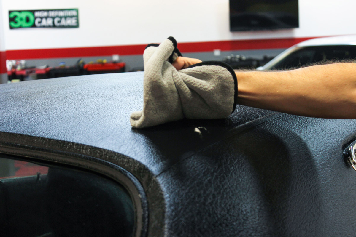 Using a micrfiber towel or a soft bristled brush, work Wolfgang Convertible Top Cleaner across the surface, gently agitating to remove contamination.