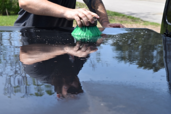 You can use the RaggTopp Convertible Top Brush to scrub the surface.