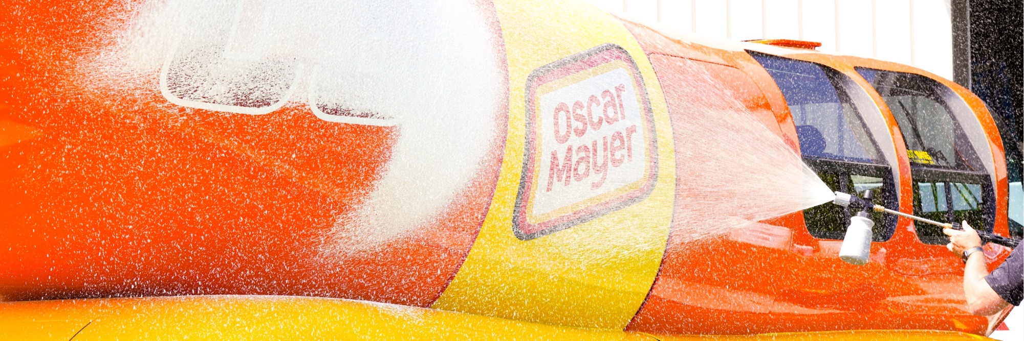 Oscar Mayer Wienermobile being detailed with a SONAX Power Foamer.