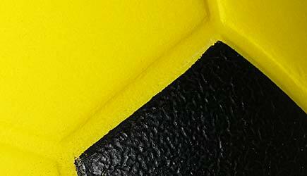 yellow-black-foam-soccer-ball-close-up.jpg