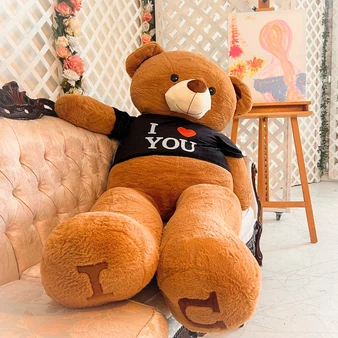 Six-foot cream-white giant teddy bear with a red heart