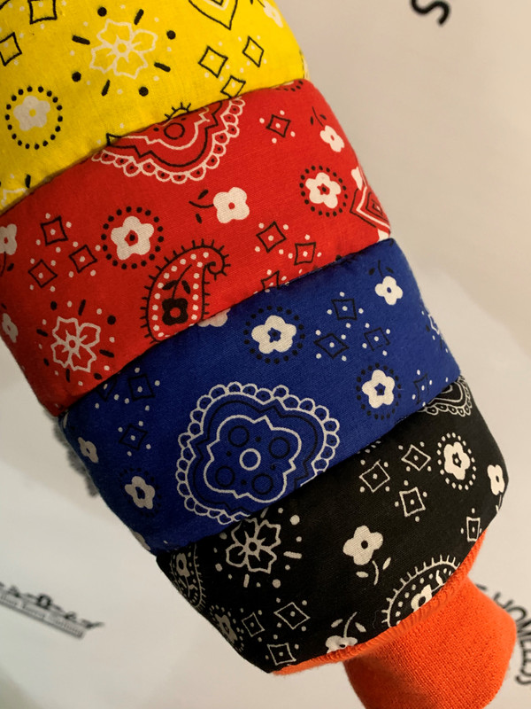 black, blue, red, yellow, pink, white bandana strips made into a puffer jacket