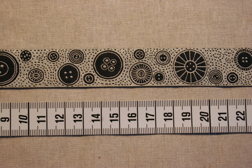 Black Buttons on Cream