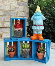 Painted Gnome and Stacked Boxes