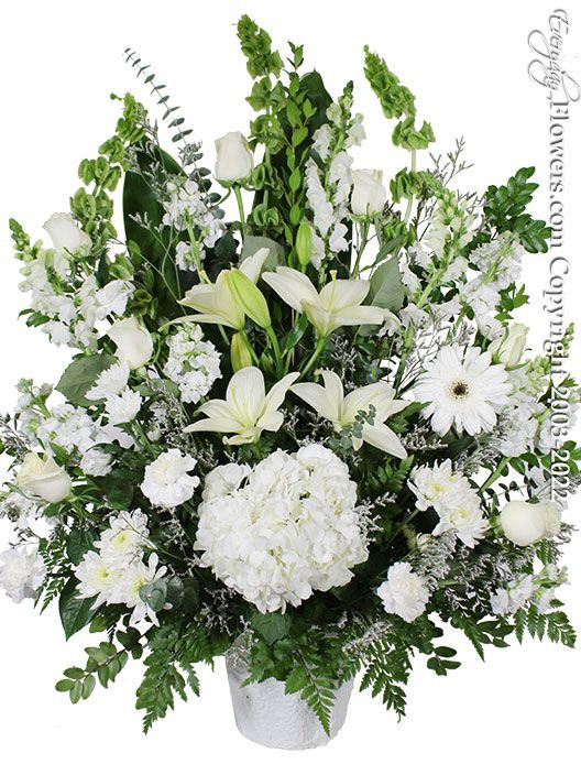 Tall and wide white floral arrangement for memorial services & funeral services located in Orange County California