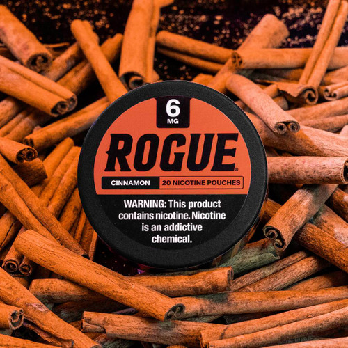 Can of Rogue 6mg cinnamon flavored pouches on background of cinnamon sticks