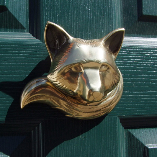 fox door knocker brass on green door