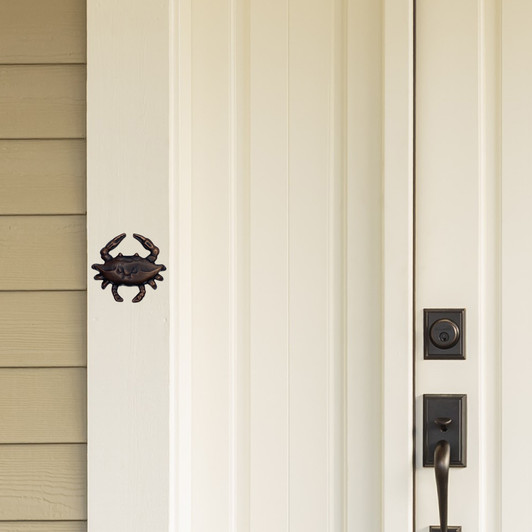 crab doorbell ringer oiled bronze white door