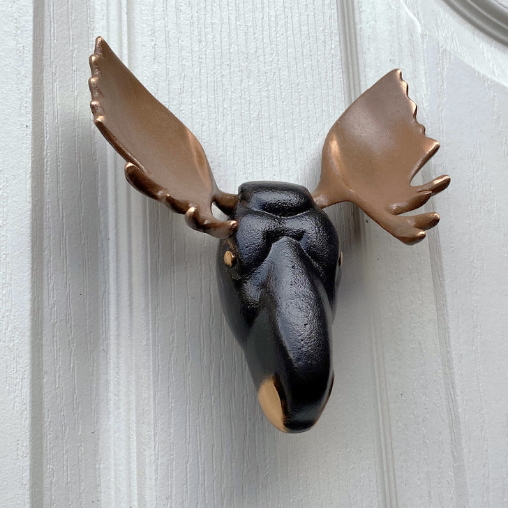 moose door knocker bronze on white door