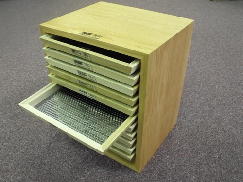 Optional Cabinet holds sieves for easy use.