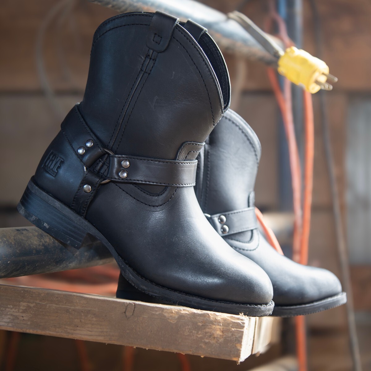 fr40601f-harnessboot-frye-supply-img-7871-1200px.jpg Women's electrical hazard work boots posed next to electrical cords