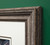 Close up of wooden frame corner on green wall