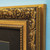Close up of ornate gold picture frame corner