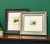 2 Small pictures framed in ornate mouldings