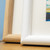 Close up of 2 picture frame corners including cream coloured mounts