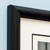 Close up of corner of black wooden frame