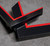 2 Polcore frame samples with carbon fibre effect finish and a gloss red inner edge.