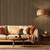 Stylish room with walnut acoustic panels, lamp, sofa and coffee table.