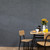 Breakfast room table with dark grey hexagonal acoustic wall panels.