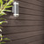 Nevis Dark Oak Composite Exterior Wall Cladding with outdoor light attached