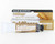 Tube of antique gold Goldfinger with display box.