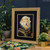 Lion framed in ornate gold picture frame with black mount
