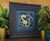 Modern art print framed in an art deco style charcoal frame