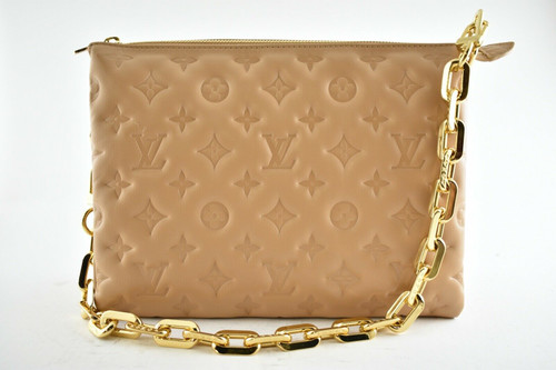 Louis Vuitton Coussin PM handbag in cream Monogram-embossed puffy lambskin with gold-tone chain and leather strap