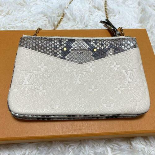Louis Vuitton Double Zip Pochette N96322 in white Monogram Empreinte leather with silver zippers and chain strap