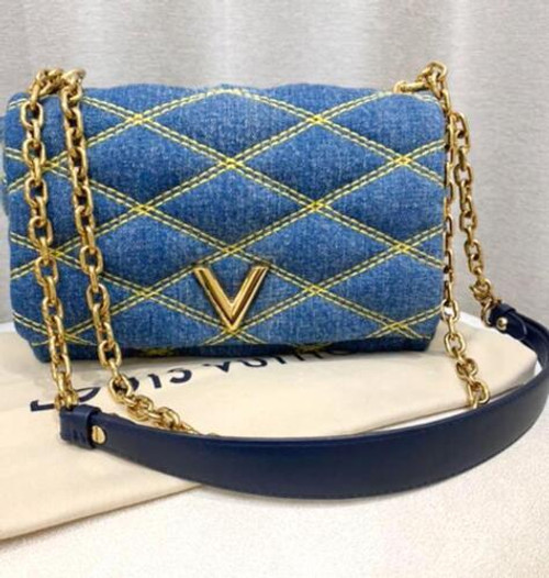 Louis Vuitton Twist MM shoulder bag in denim blue Épi leather with gold LV Twist-lock closure and removable silver chain-and-leather strap